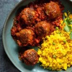 Bison meatballs in chipotle salsa served with Mexican yellow rice.