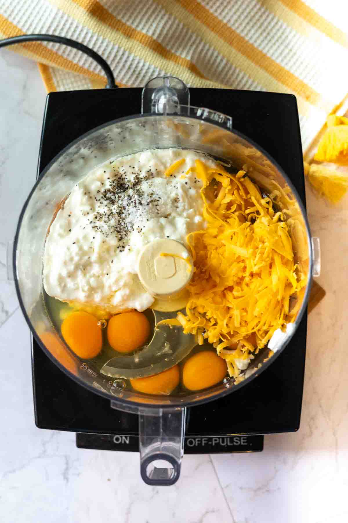 Custard ingredients in a food processor to make cottage cheese egg bites.