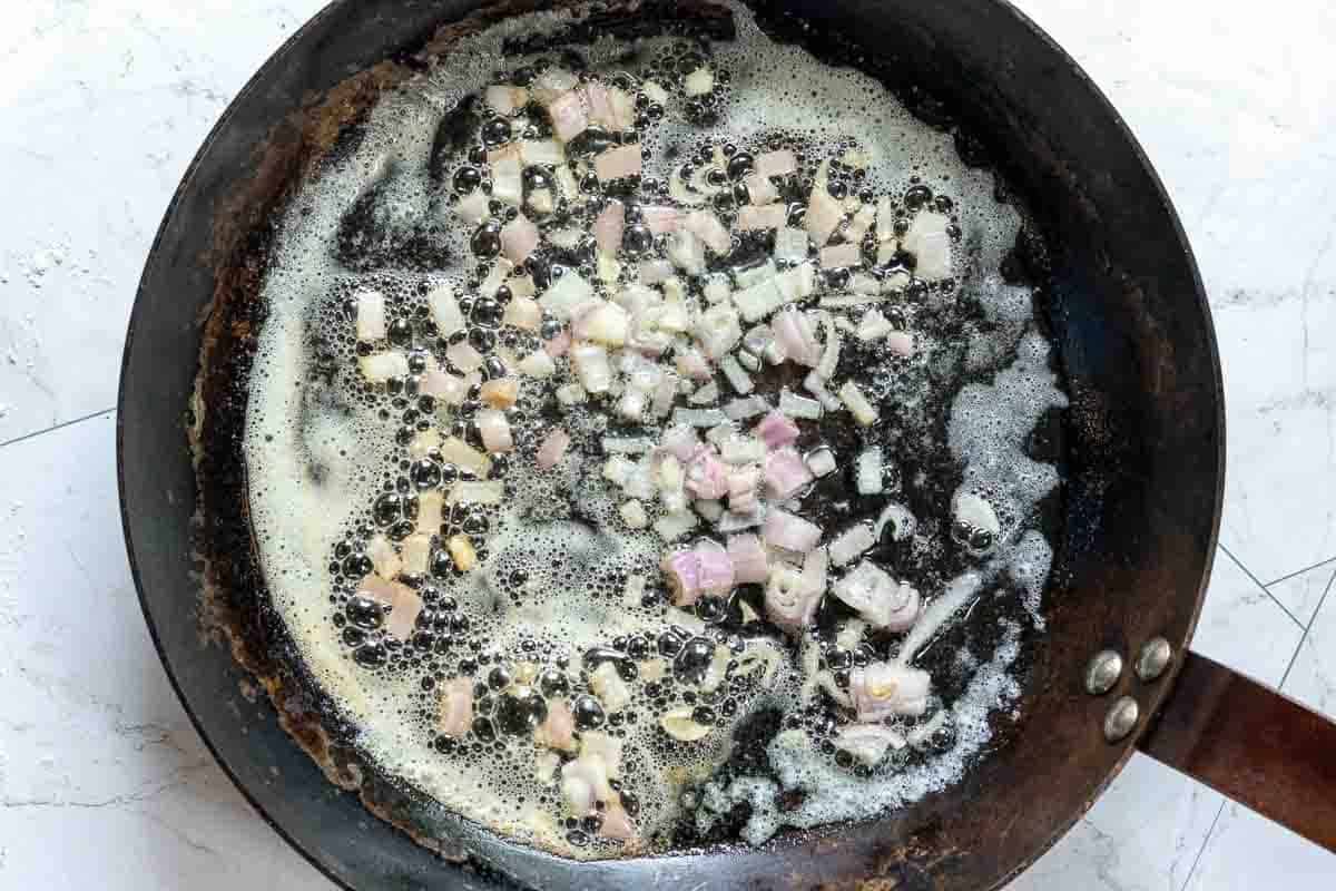 Cooking shallots to make Blue Cheese Sauce for Denver Steak.