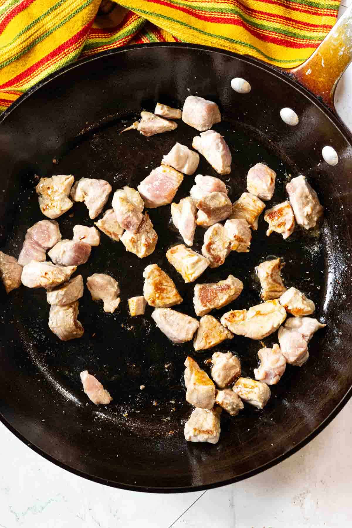 Step 1 to make pork tenderloin tacos, browning the pork.