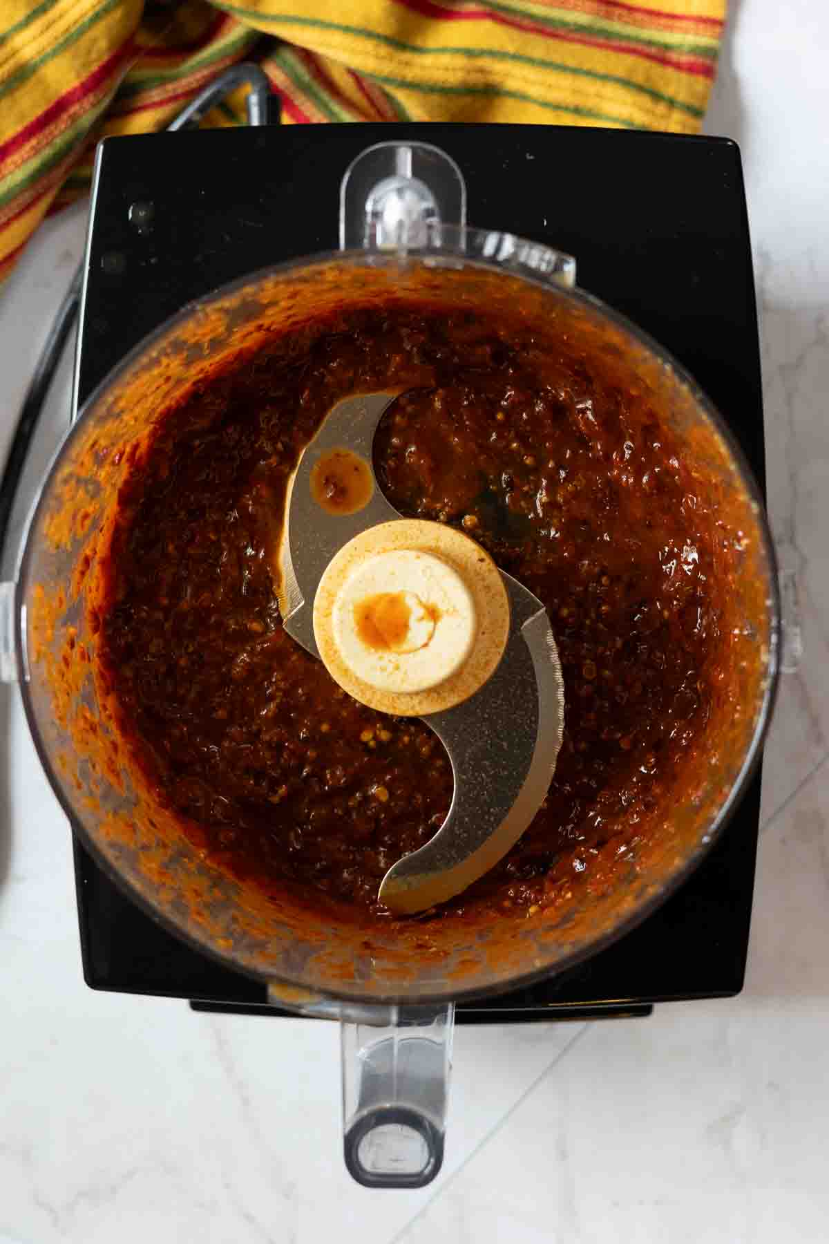 Guajillo chile sauce made in a food processor to make pork tenderloin tacos.