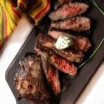 Sliced pan fried merlot steak topped with blue cheese butter.