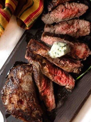 Sliced pan fried merlot steak topped with blue cheese butter.