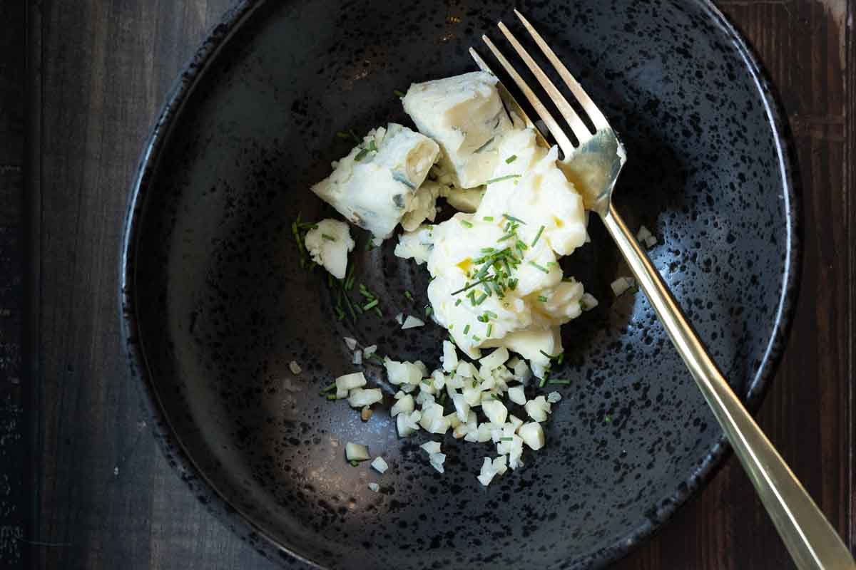 Ingredients to make blue cheese butter in a bowl.