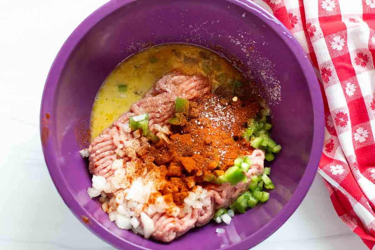 ngredients in a bowl to make turkey burgers for the grill.