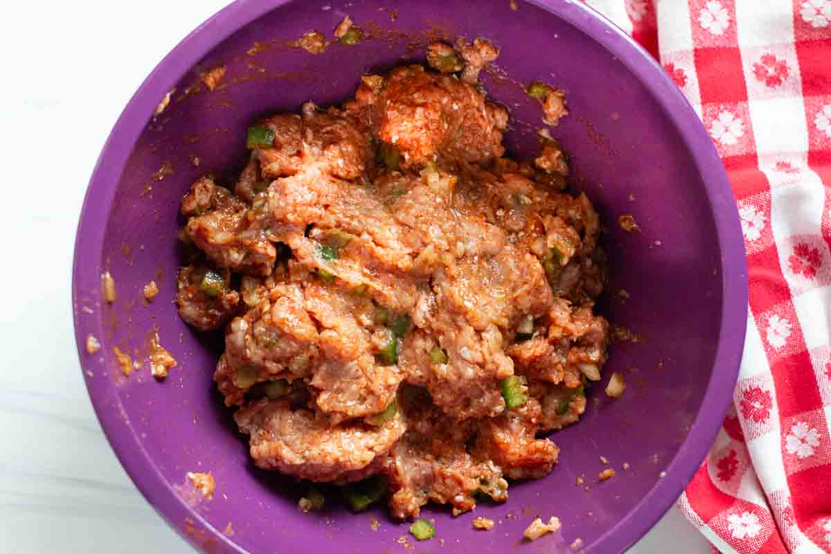 Ground turkey mixed with seasonings and jalapeno peppers to make turkey burgers for the grill.