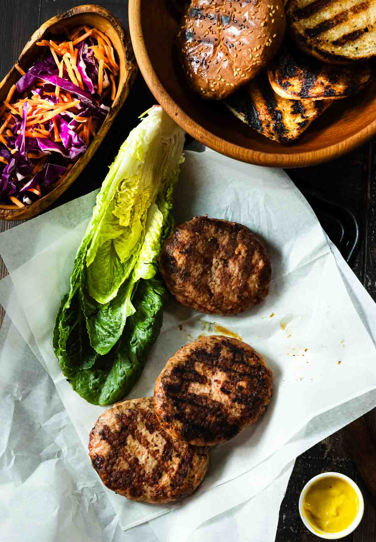 Turkey burgers for the grill with toasted buns and coleslaw.