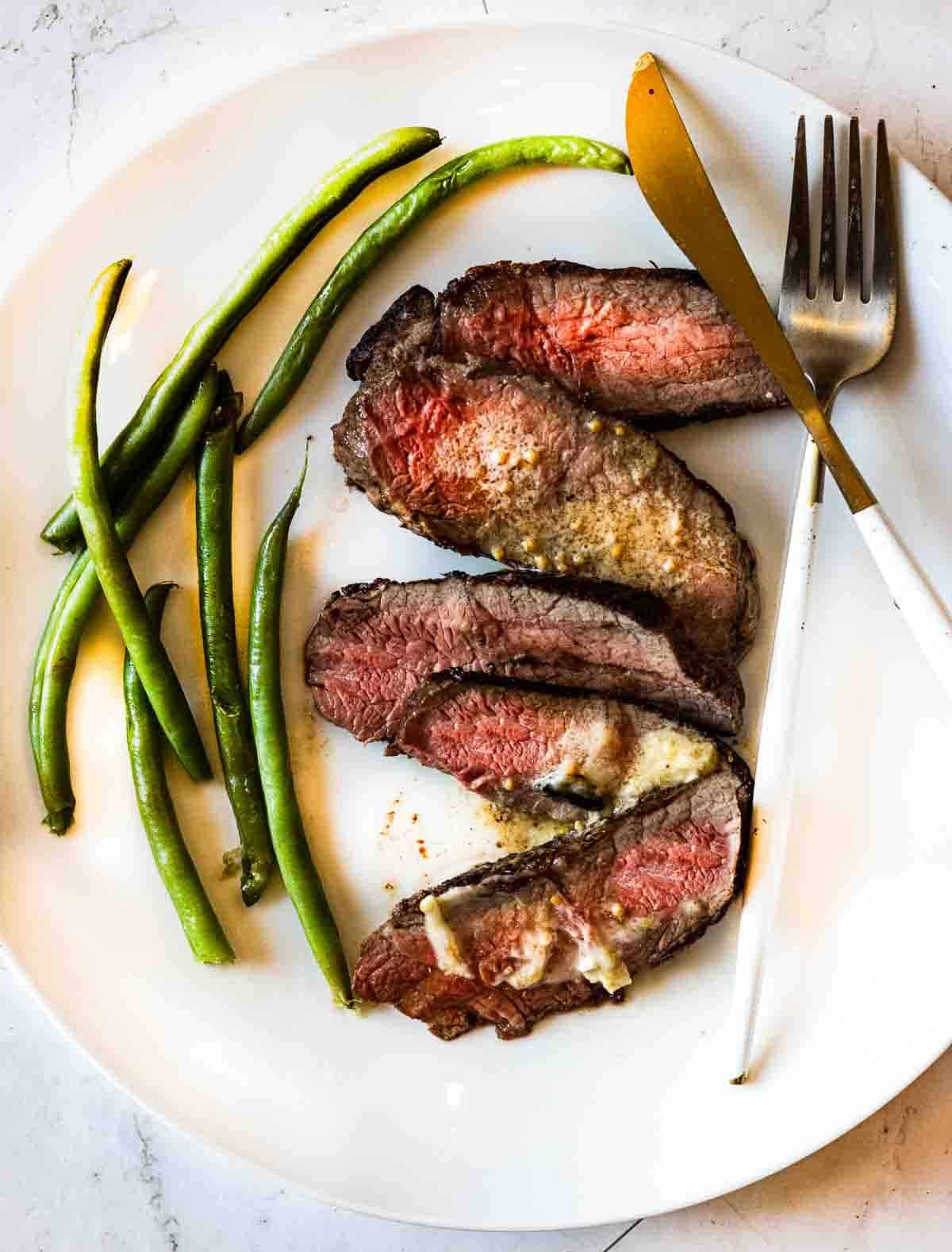 Pan seared baseball steaks served with green beans.