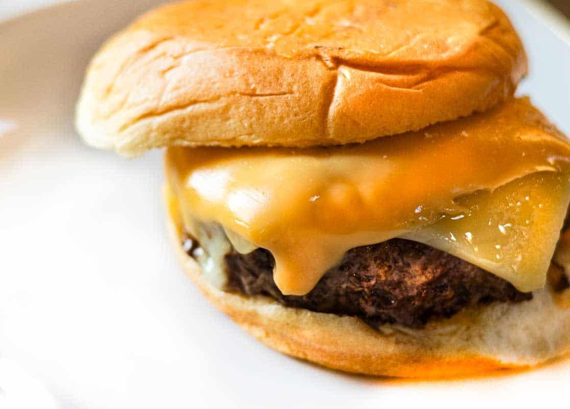 Maverick burger with American and Swiss Cheese.