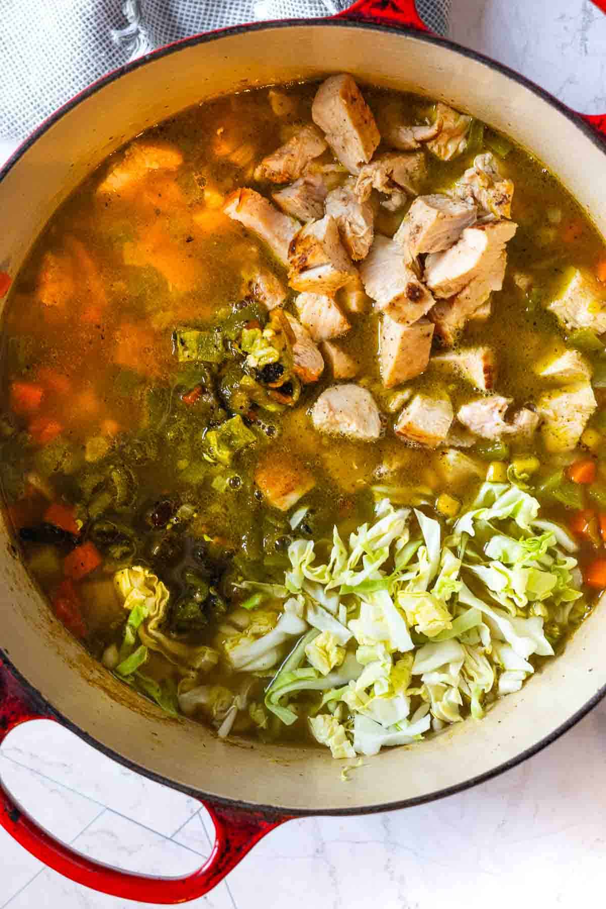 Simmering soup ingredients to finish the chicken cabbage soup.