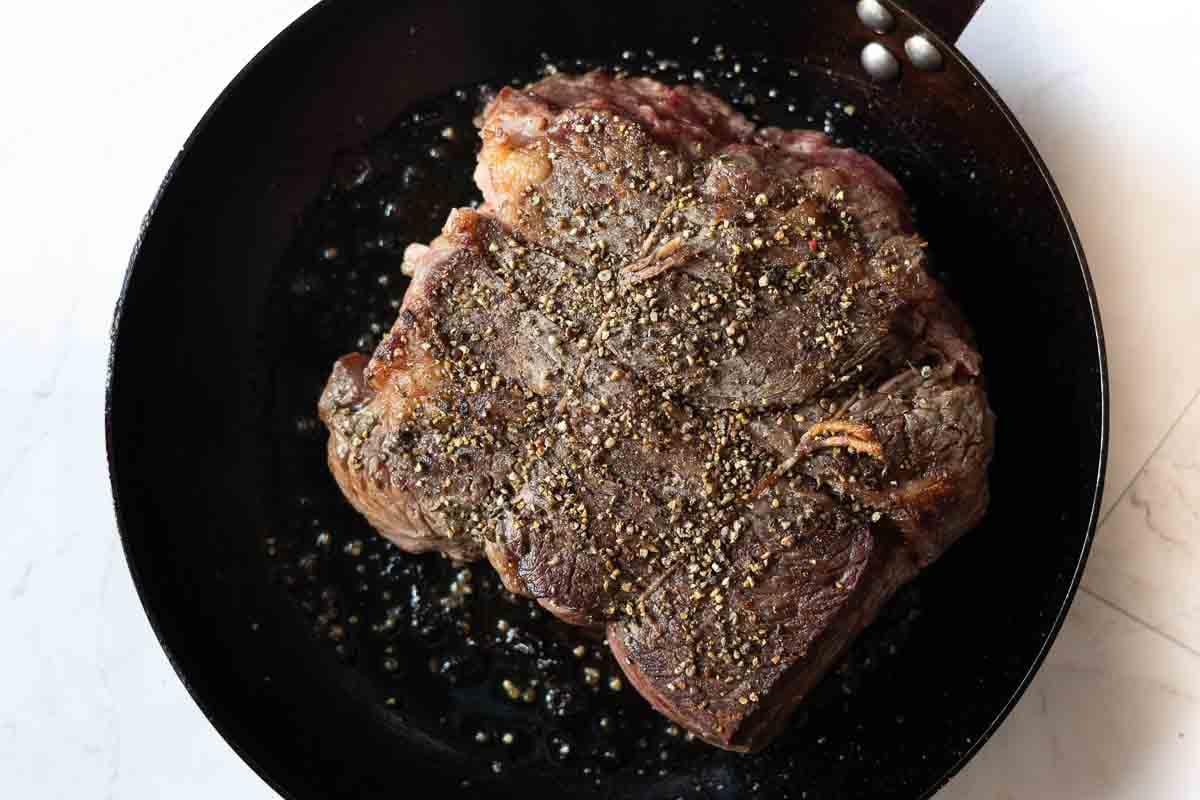 Step 2: Seasoning a chuck eye roast.