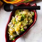 Jalapeno pineapple salsa in a red chile shaped serving bowl.