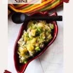 Jalapeno pineapple salsa served in a red chile pepper bowl.