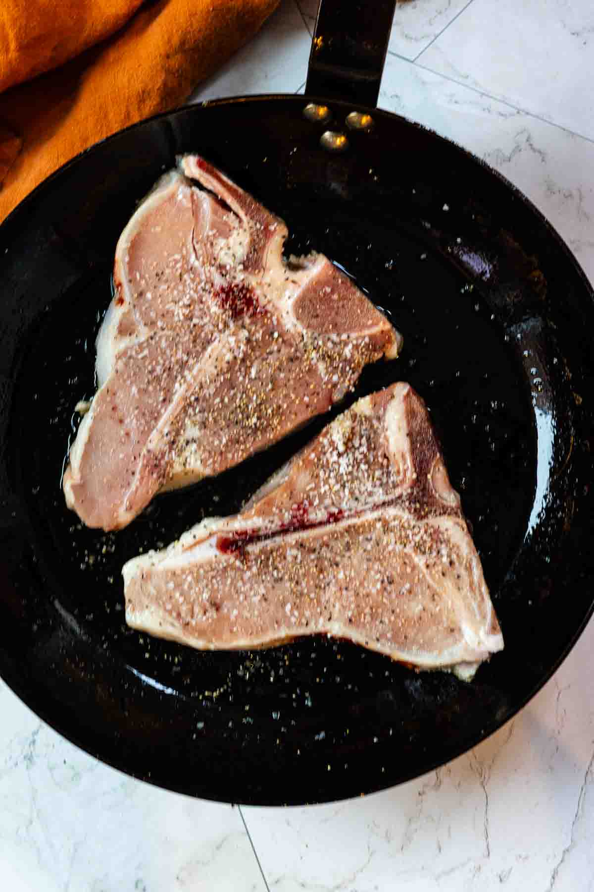 Two veal loin chops pan searing. Step 1, how to cook veal.